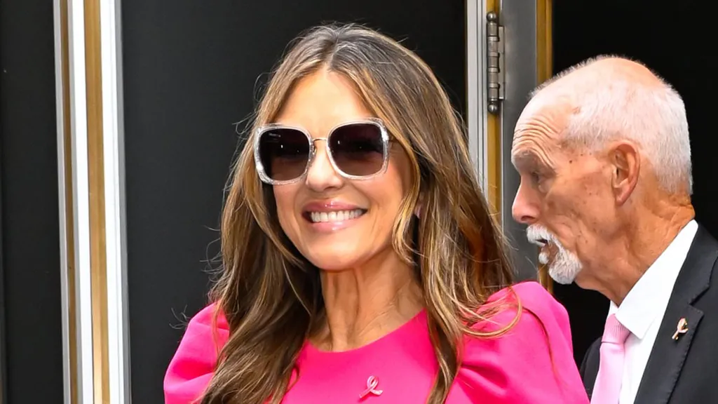Elizabeth Hurley in FOUR pink outfits for Breast Cancer Awareness