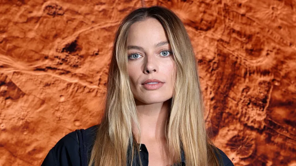 Margot Robbie displays her toned physique in a bralet at Chanel show