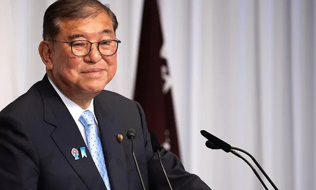 Japan's Ishiba says he'll stay in office to tackle inflation and US...