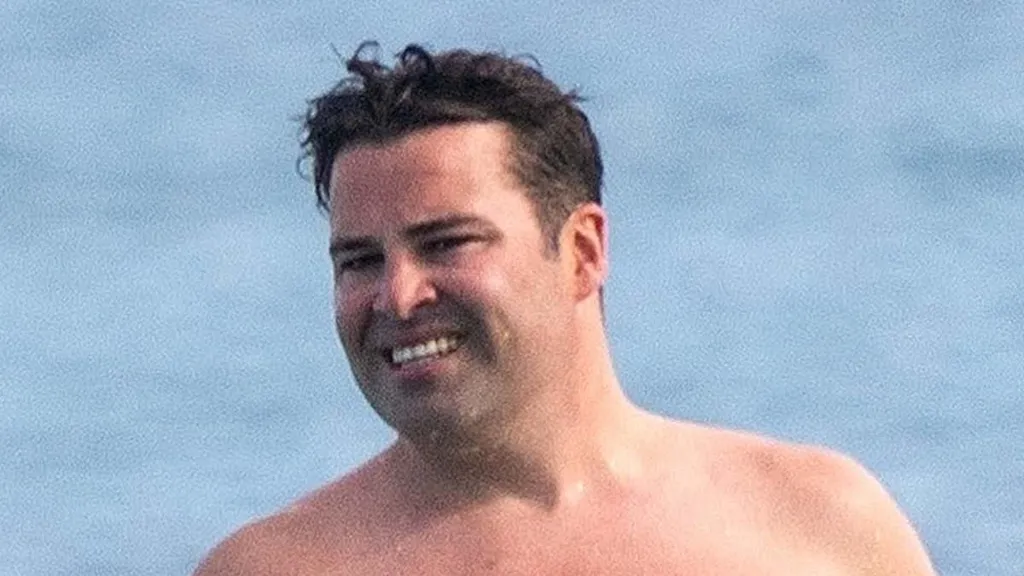 X Factor's Joe McElderry looks unrecognisable during Barbados getaway