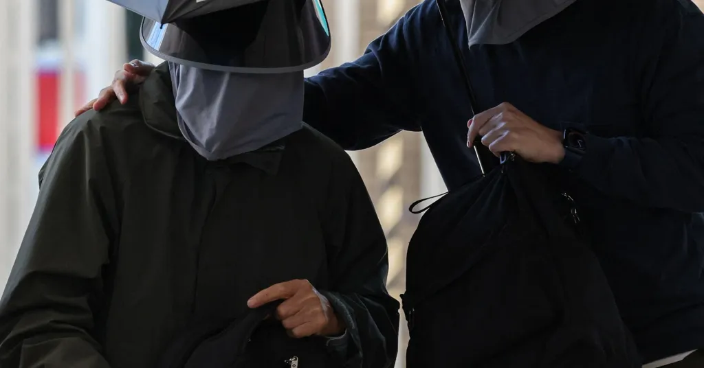 Hong Kong activist's father convicted under national security law over insurance policy