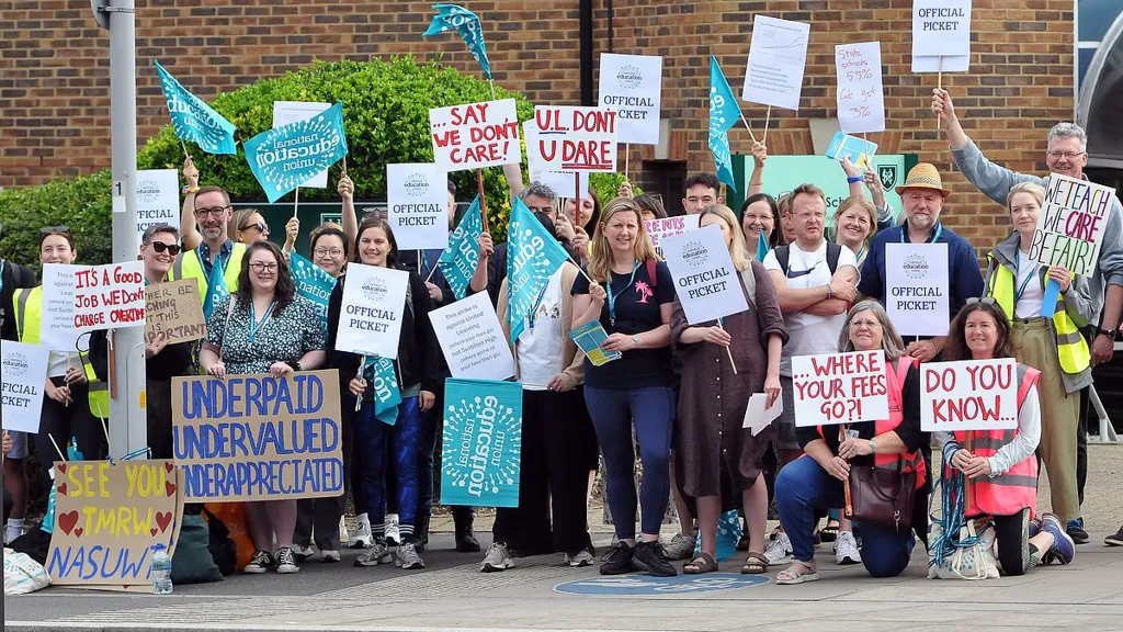 Teachers strike as 'nine in ten at chain claim they have second jobs'