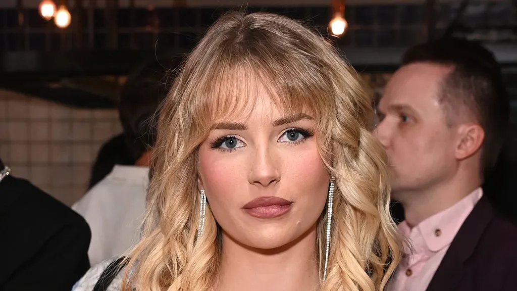 Lottie Moss cuts an elegant figure in white beaded dress