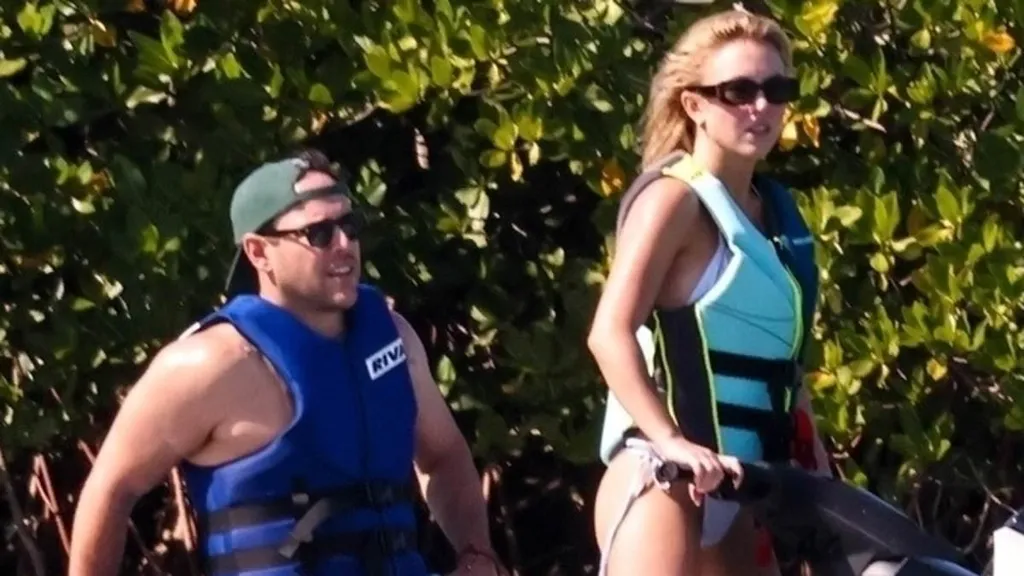 Sydney Sweeney, 28, models cheeky bikini with Scooter Braun, 44