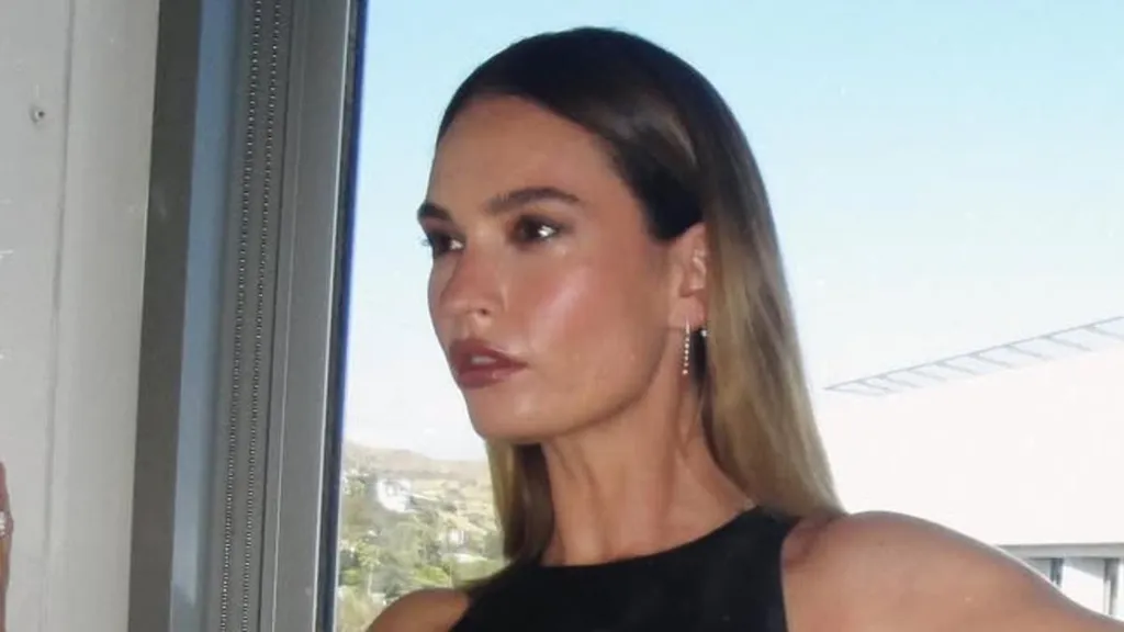 Lily James flaunts her toned physique in a daring cut-out gown
