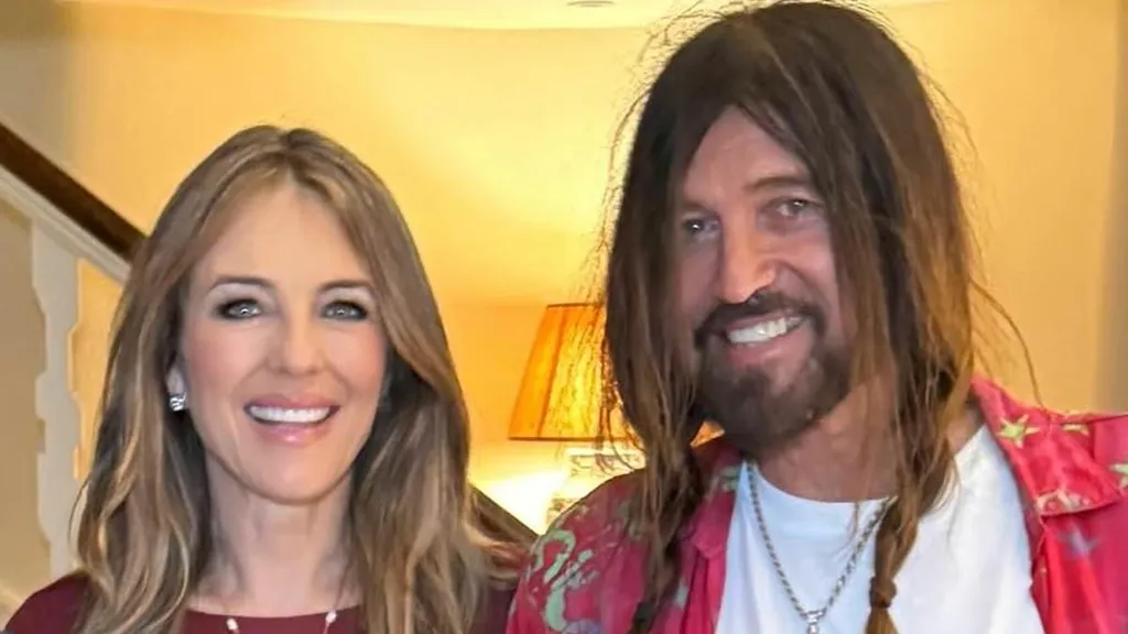 Elizabeth Hurley plants a passionate kiss on Billy Ray Cyrus