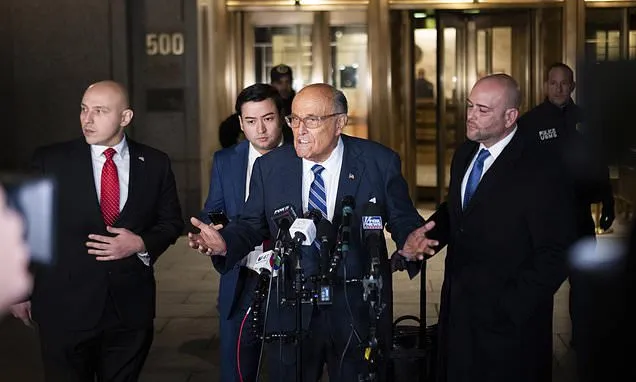 Judge will weigh holding Giuliani in contempt of court after jury's...